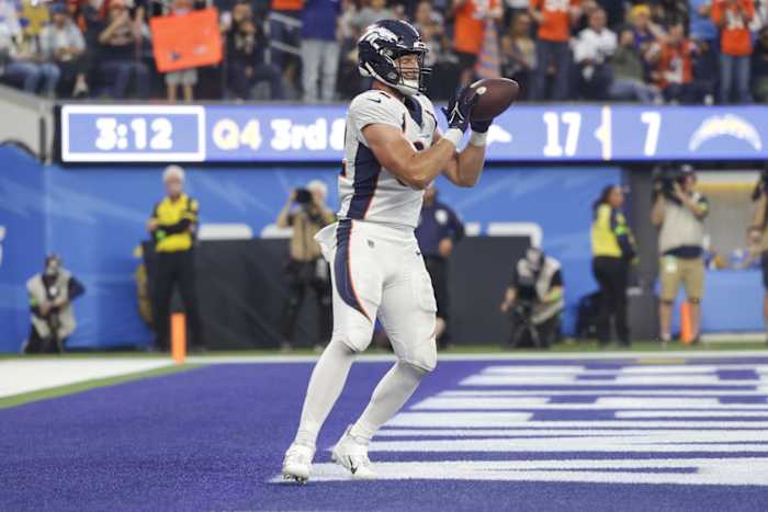 Dec 10, 2023; Inglewood, California, USA; Denver Broncos tight end Adam Trautman (82) scores a touchdown during the second half in a game against the Los Angeles Chargers at SoFi Stadium. Mandatory Credit: Yannick Peterhans-USA TODAY Sports  